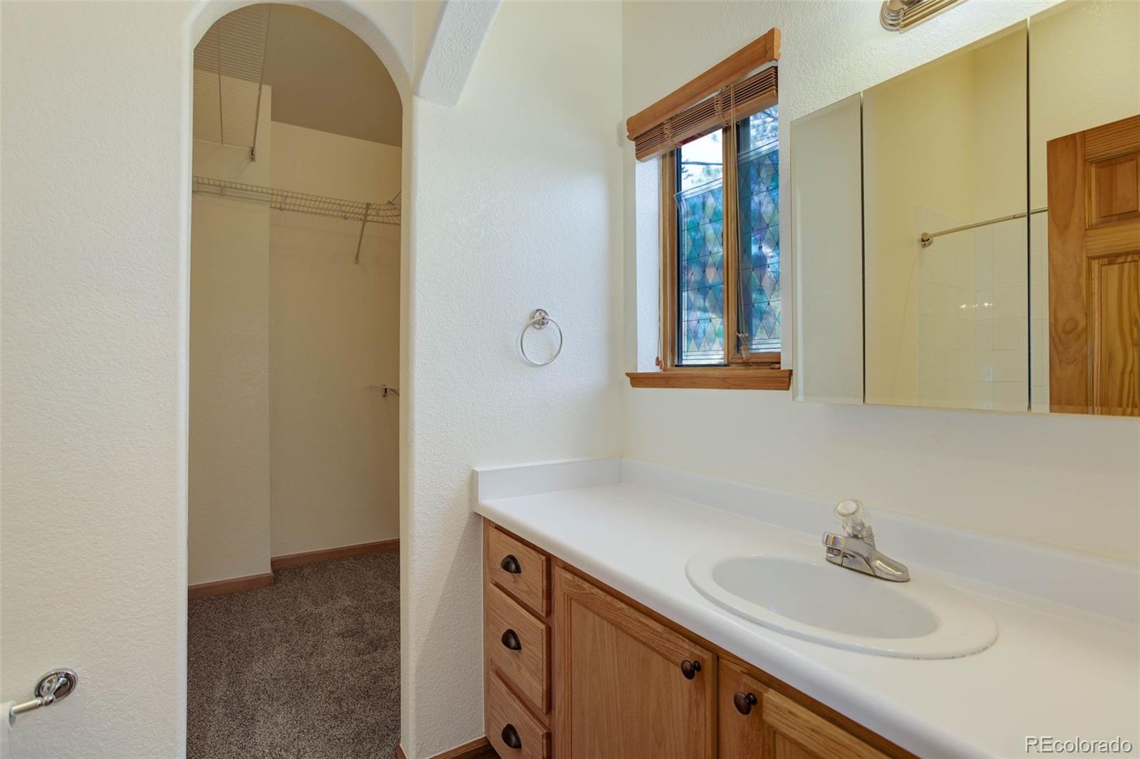 45 Catamount Ridge Road Bailey, CO 80421 - Photo 24 of 39 a bathroom with a sink and a mirror