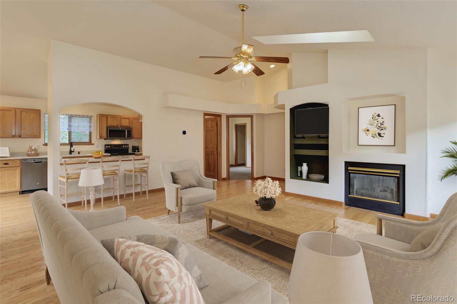 45 Catamount Ridge Road Bailey, CO 80421 - Photo 3 of 39 a living room with furniture a fireplace and a flat screen tv