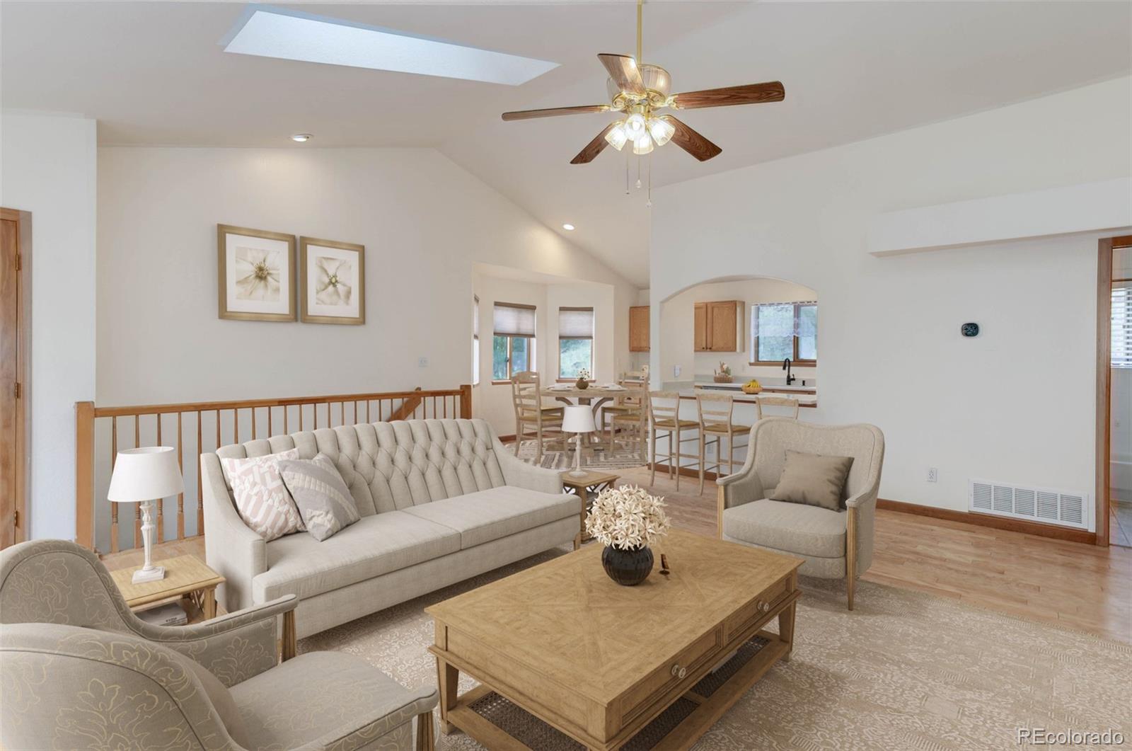 45 Catamount Ridge Road Bailey, CO 80421 - Photo 4 of 39 a living room with furniture and a chandelier