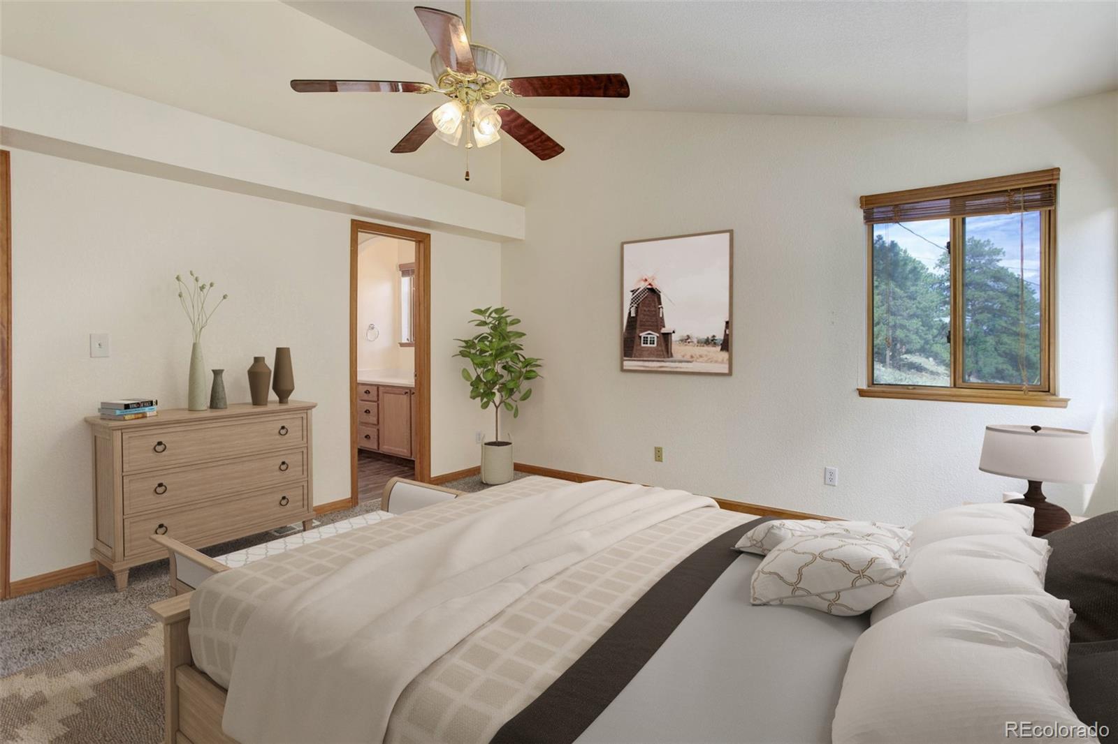 45 Catamount Ridge Road Bailey, CO 80421 - Photo 6 of 39 a bedroom with a large bed and a window