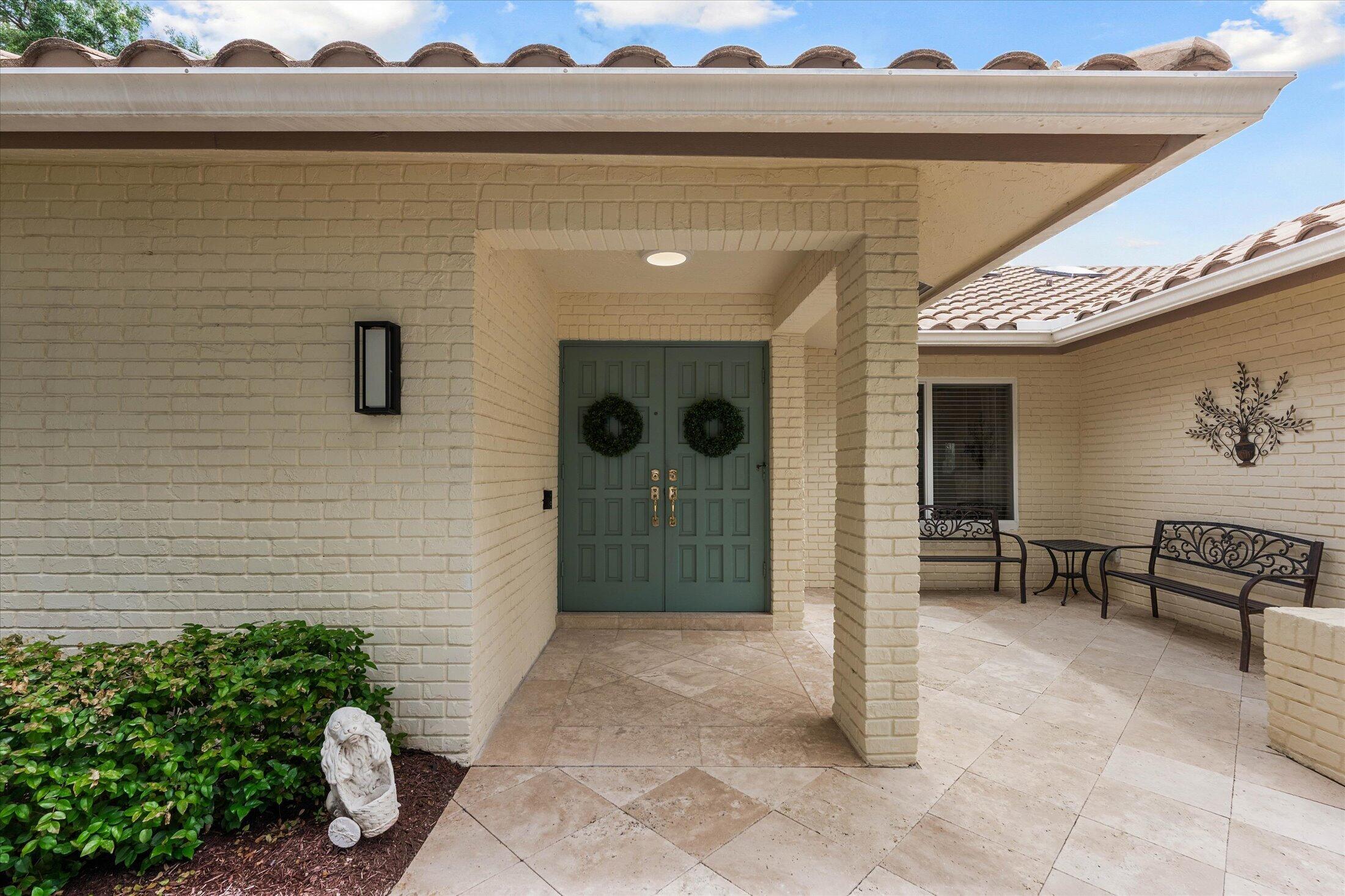 2699 Northwest 38th Street Boca Raton, FL 33434 - Photo 4 of 44 Front of House Entry with Sitting Area