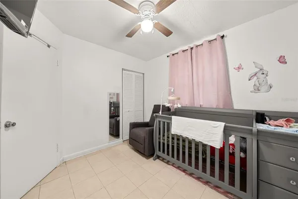 a bedroom with furniture and a chandelier