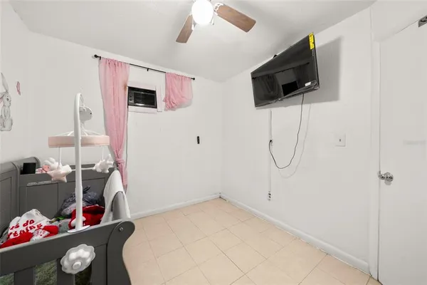 a view of a livingroom with furniture and flat screen tv
