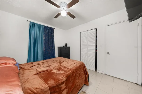 a bed room with a bed and a chandelier