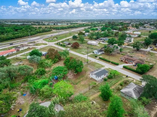 a view of a lake and yard from a balcony