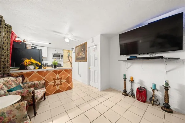 a view of a livingroom with furniture and a flat screen tv
