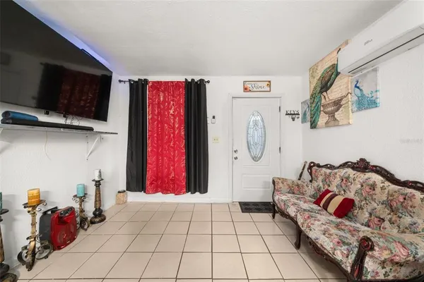 a living room with lots of furniture and a flat screen tv