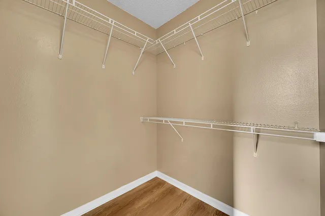 a bathroom with a sink a large mirror and a bathtub