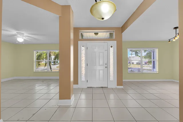 a kitchen with a stove a sink and a refrigerator