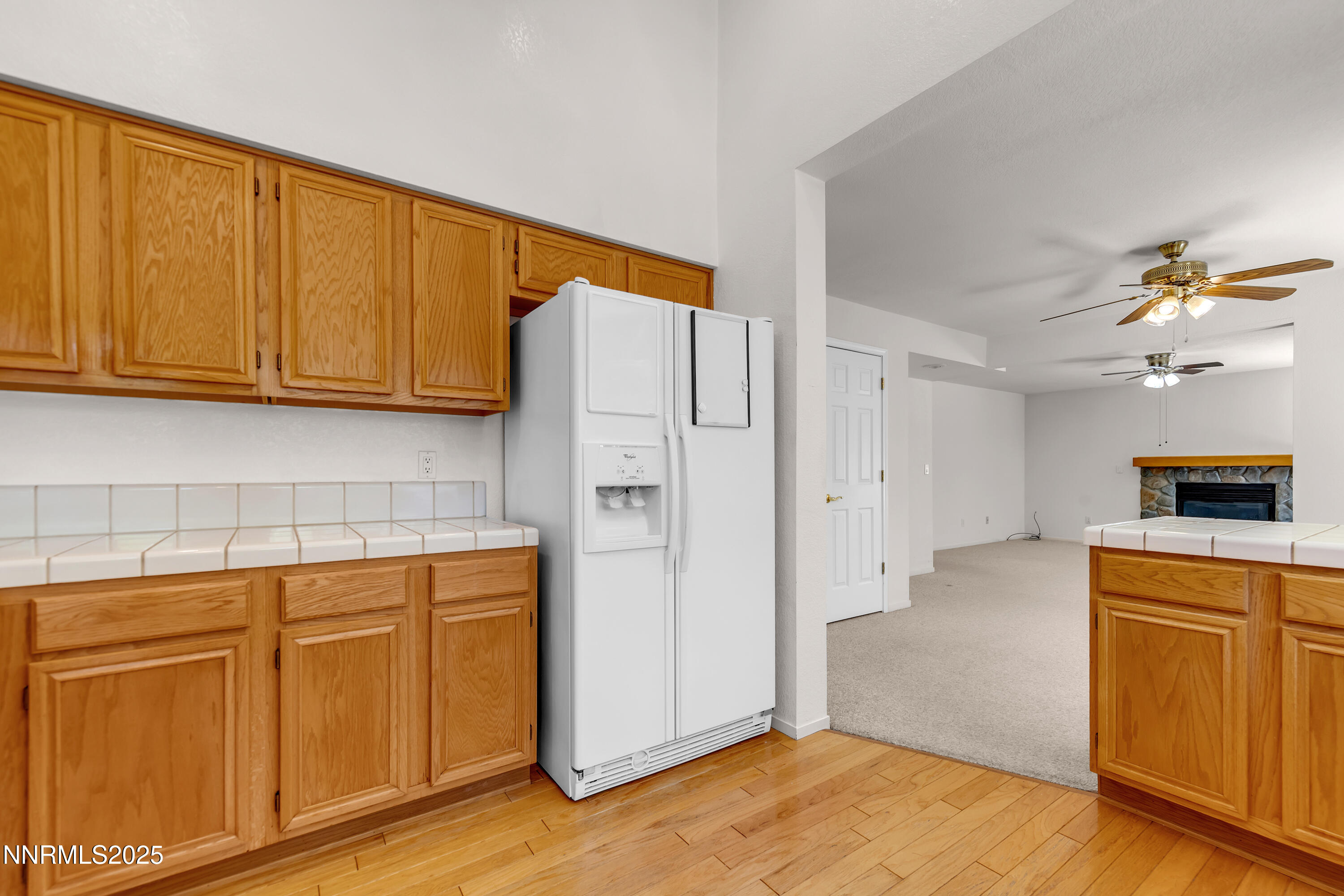 1850 Tess Way Reno, NV 89511 - Photo 13 of 50 a kitchen with a refrigerator and cabinets