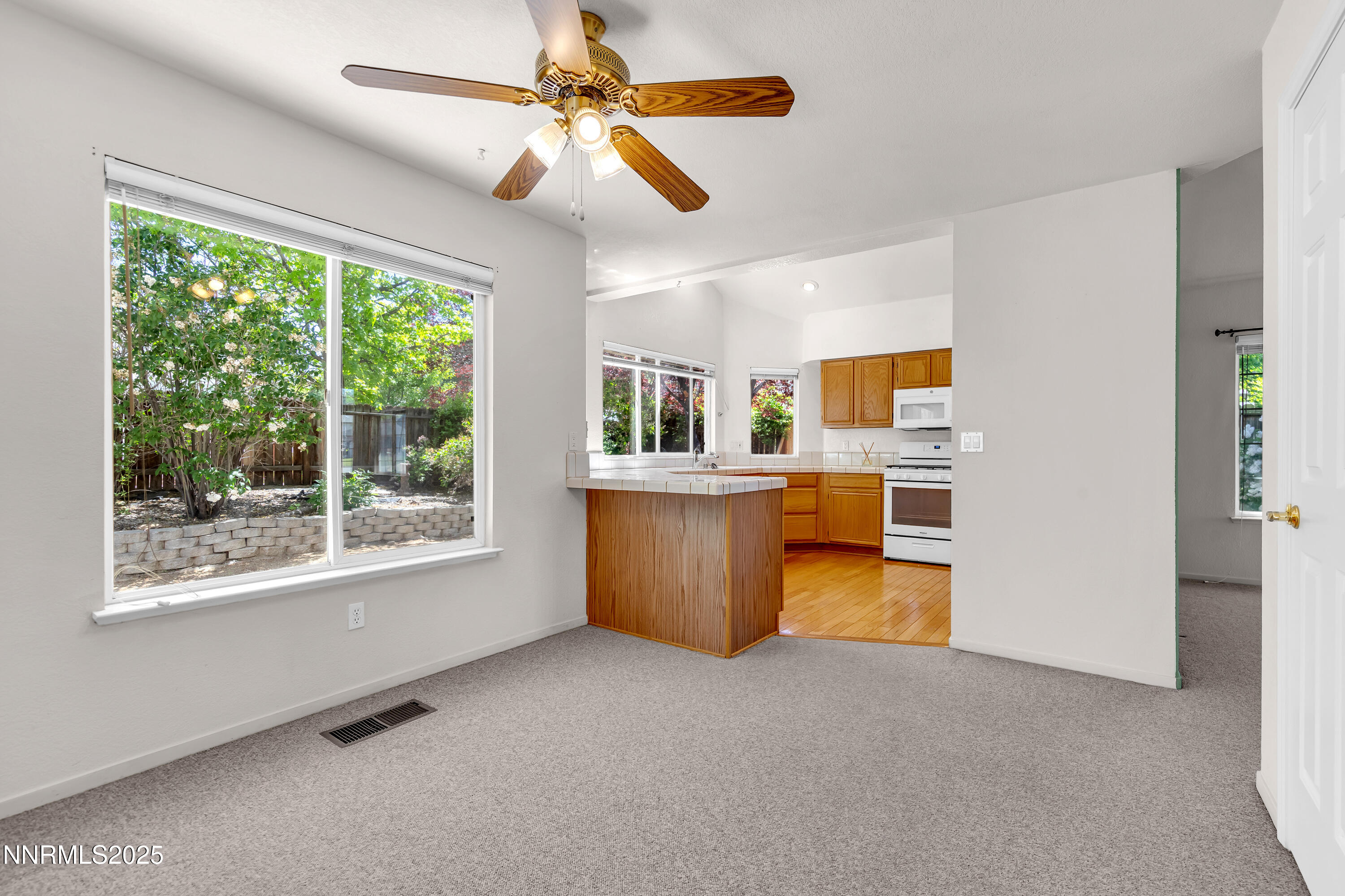 1850 Tess Way Reno, NV 89511 - Photo 14 of 50 a view of a kitchen with microwave and windows