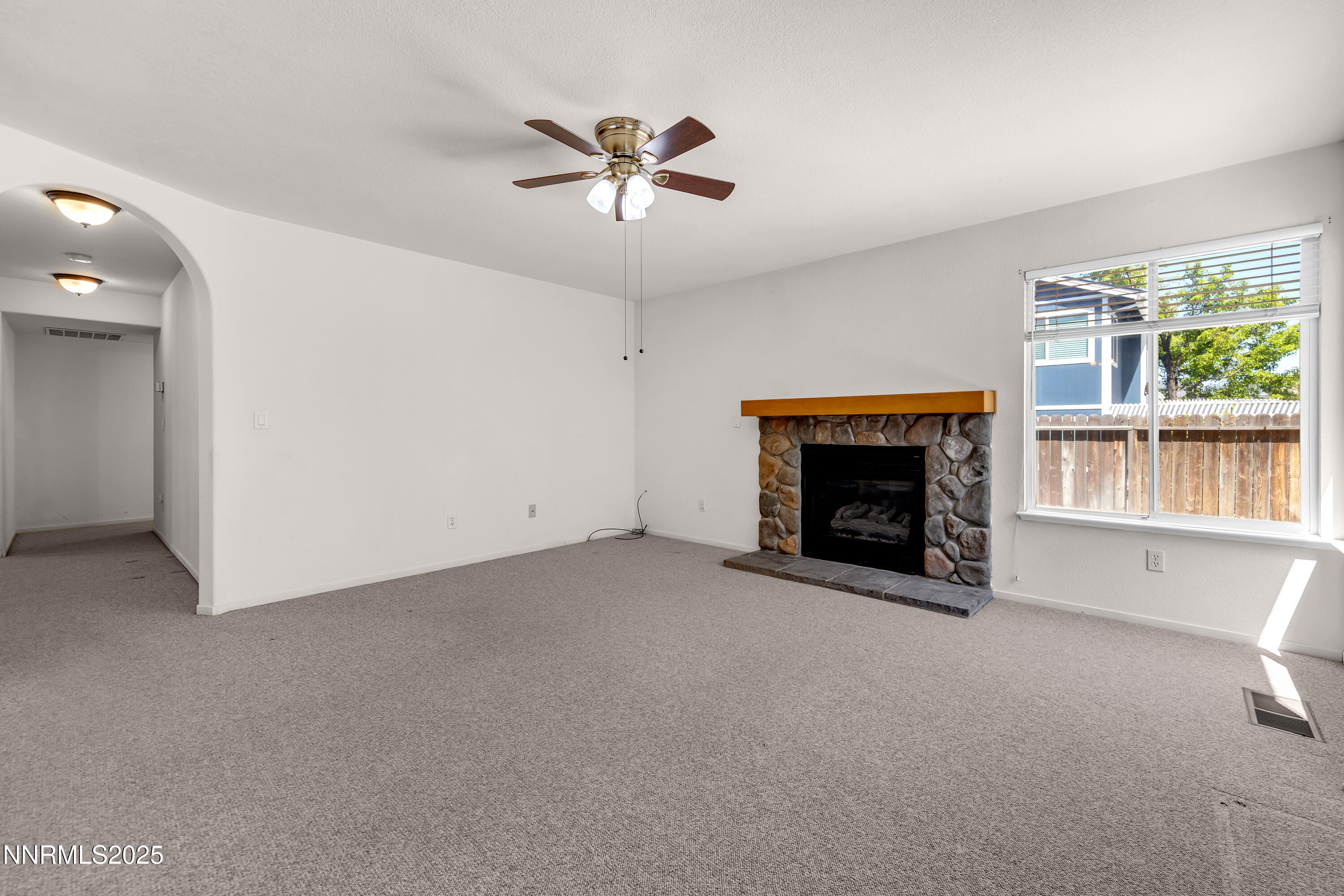 1850 Tess Way Reno, NV 89511 - Photo 18 of 50 a view of an empty room with window and fire place