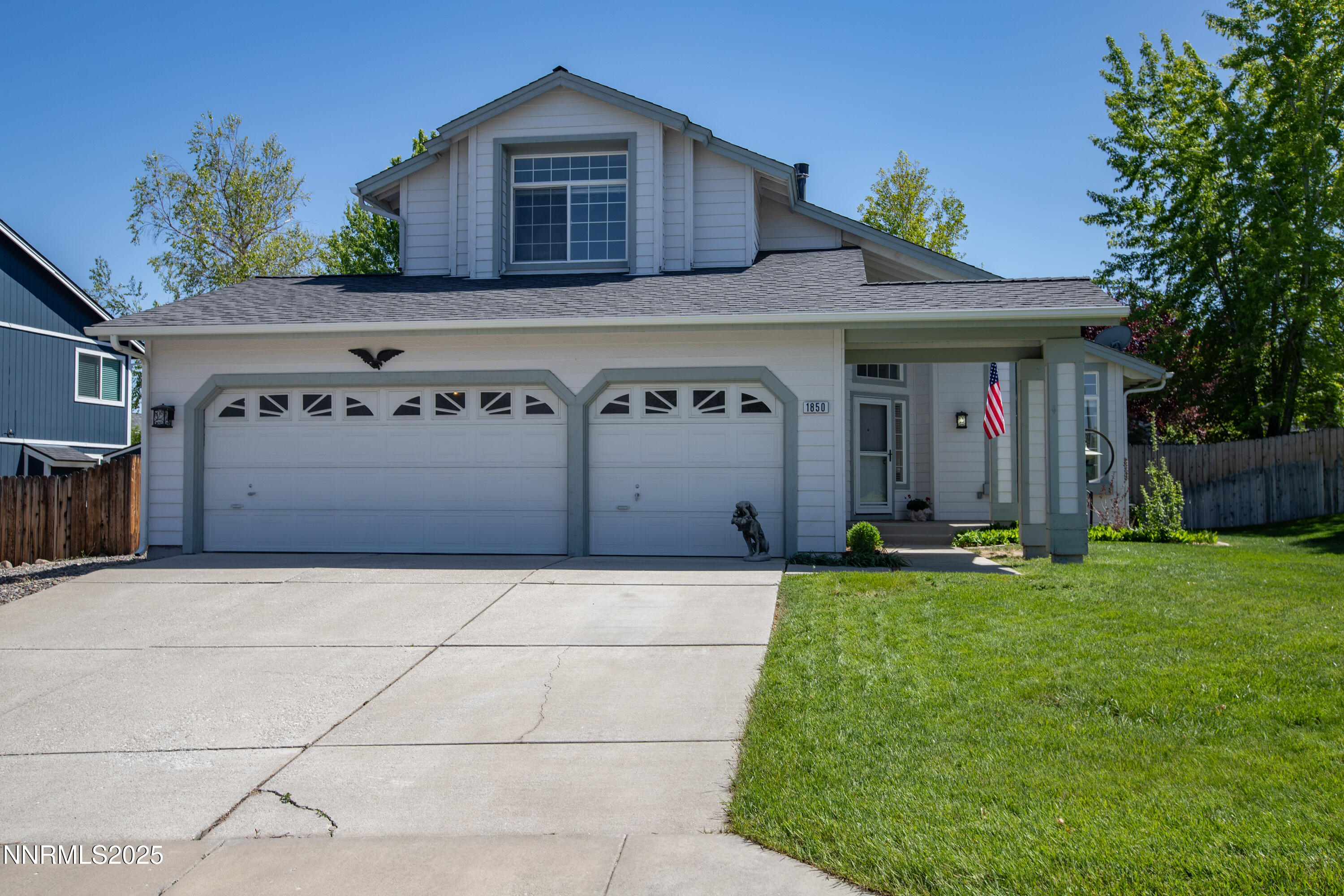 1850 Tess Way Reno, NV 89511 - Photo 2 of 50 a front view of a house with a yard