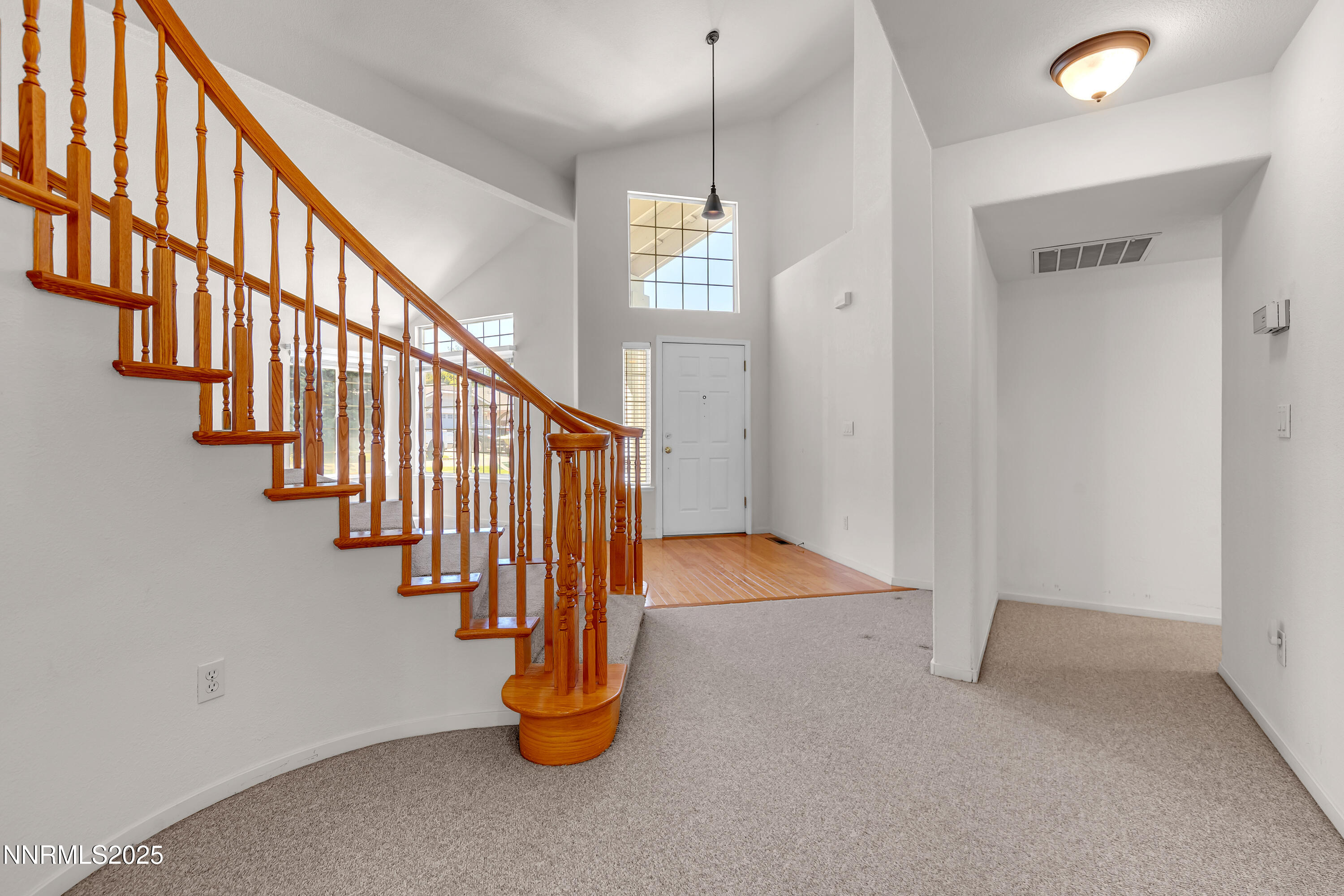 1850 Tess Way Reno, NV 89511 - Photo 21 of 50 a view of entryway with wooden floor and stairs