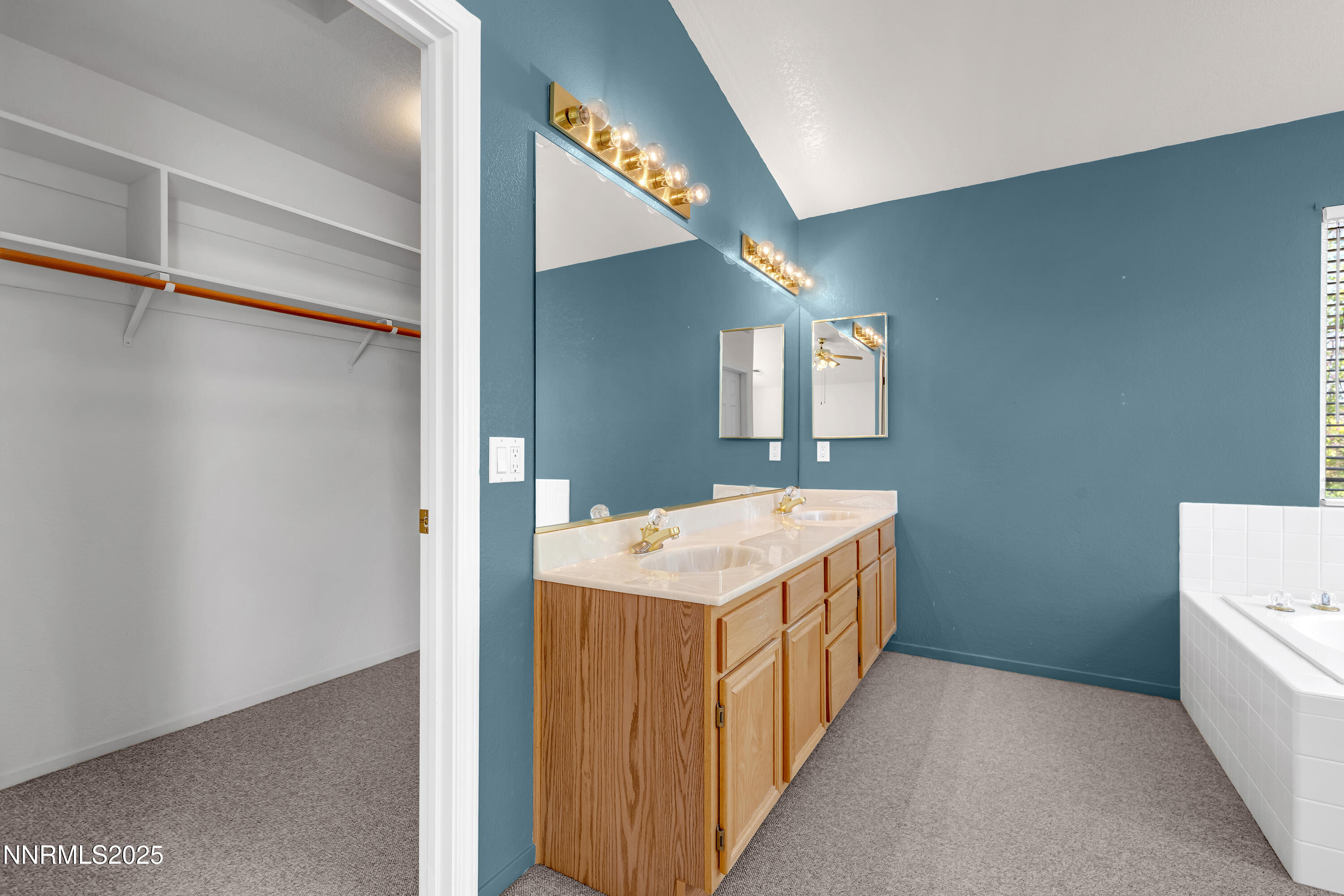 1850 Tess Way Reno, NV 89511 - Photo 25 of 50 a bathroom with a sink and a mirror