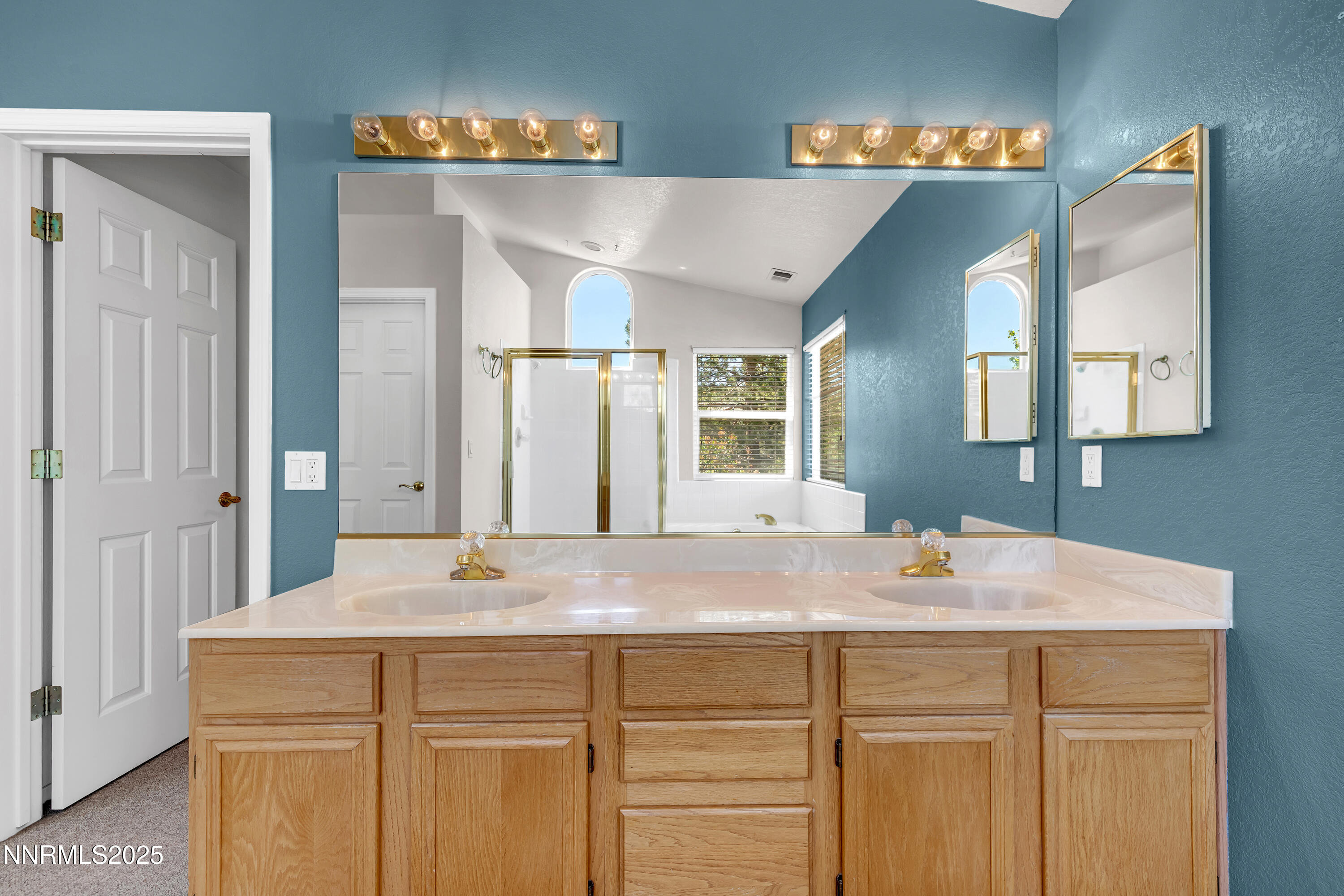 1850 Tess Way Reno, NV 89511 - Photo 26 of 50 a bathroom with a sink and a mirror