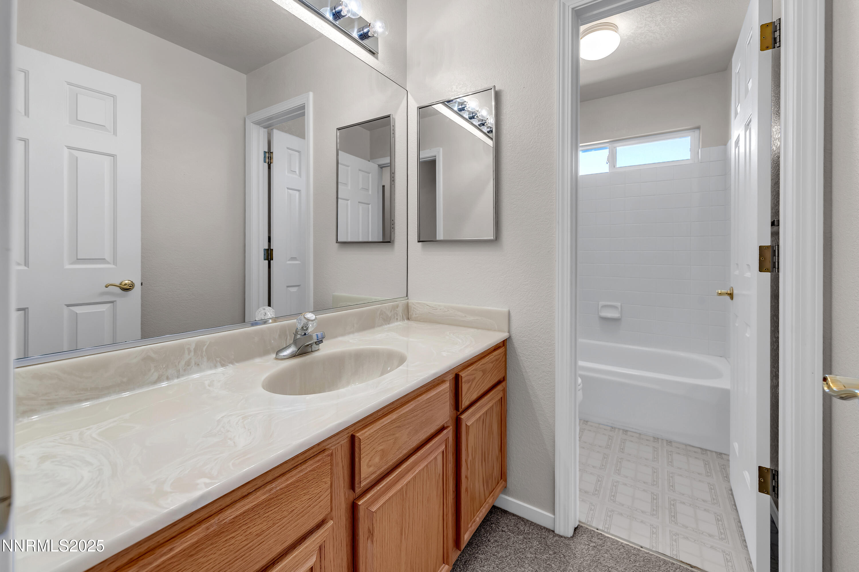 1850 Tess Way Reno, NV 89511 - Photo 33 of 50 a bathroom with a sink and a mirror