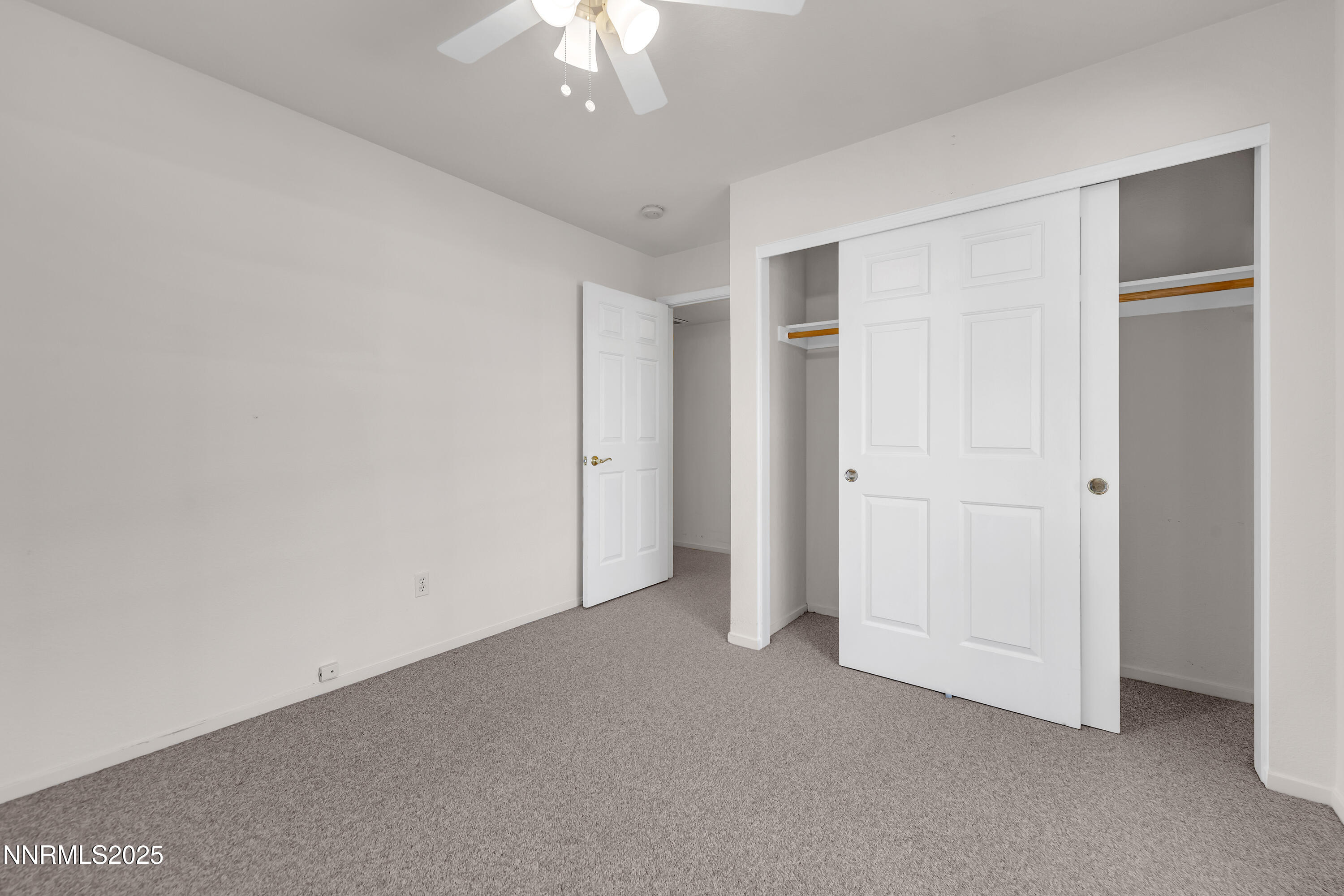 1850 Tess Way Reno, NV 89511 - Photo 36 of 50 an empty room with a chandelier fan