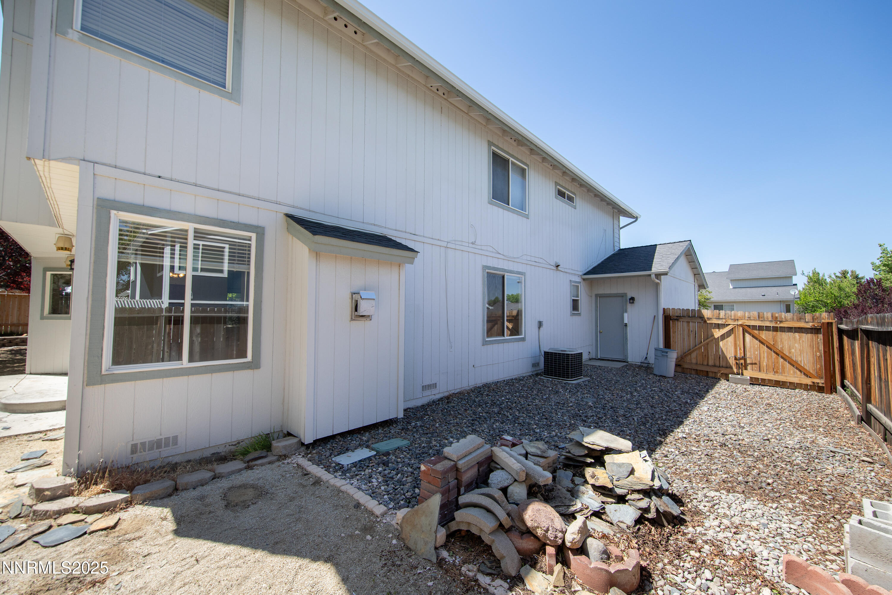 1850 Tess Way Reno, NV 89511 - Photo 43 of 50 a front view of a house with a yard