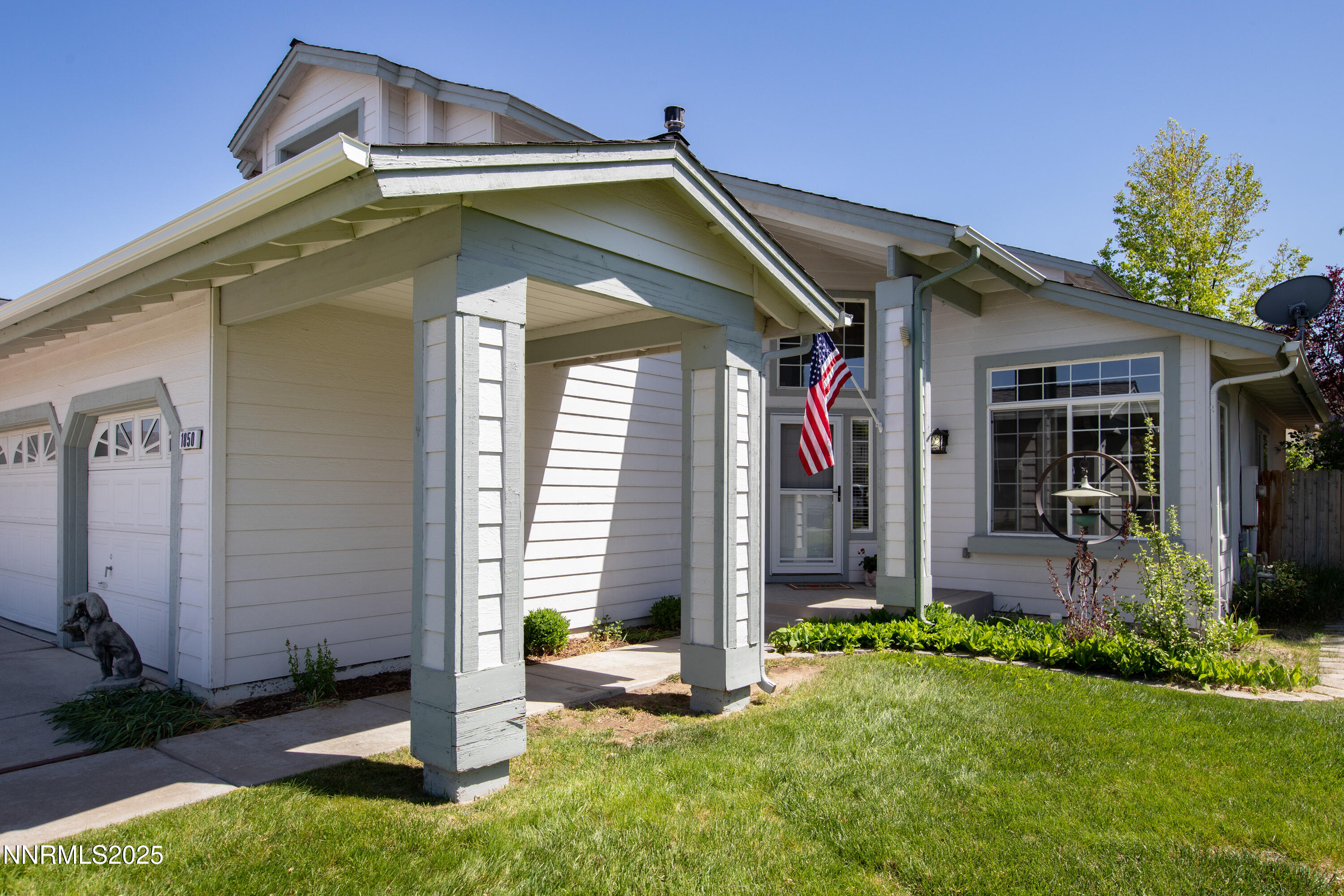 1850 Tess Way Reno, NV 89511 - Photo 49 of 50 a front view of a house with garden