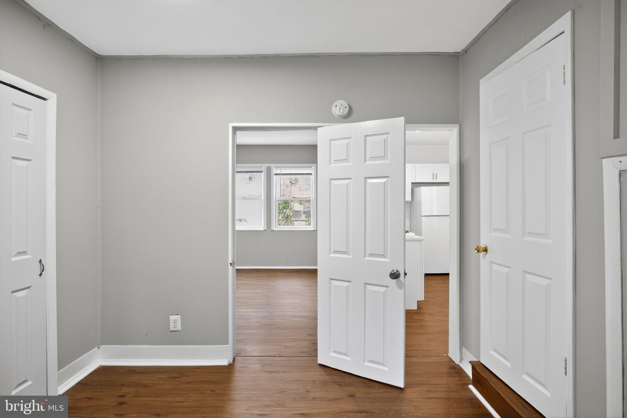 5446 Narcissus Avenue, Unit 1 Baltimore, MD 21215 - Photo 18 of 21 a view of empty room with wooden floor