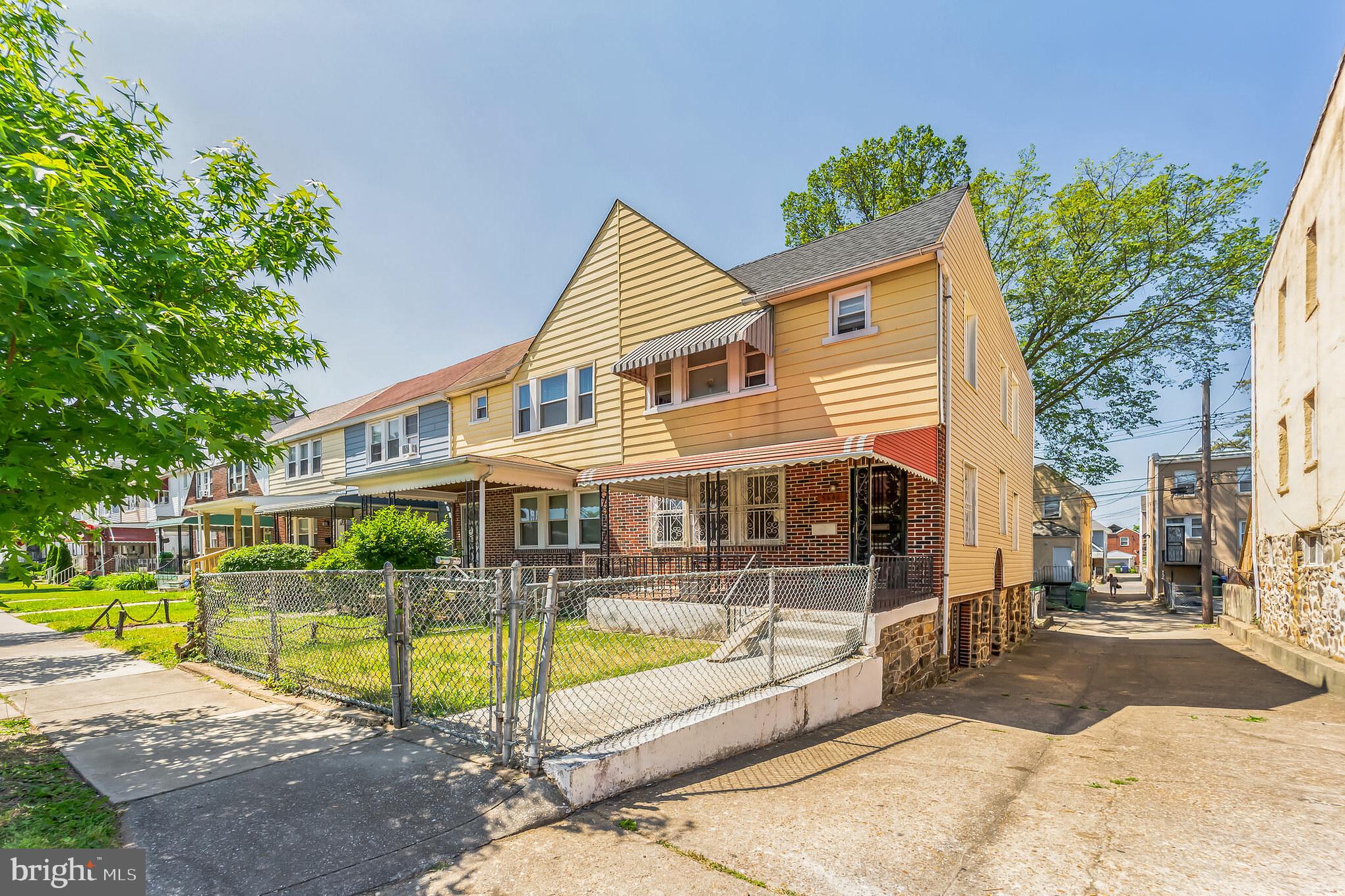 5446 Narcissus Avenue, Unit 1 Baltimore, MD 21215 - Photo 2 of 21 a view of a white building with a swimming pool and sitting area