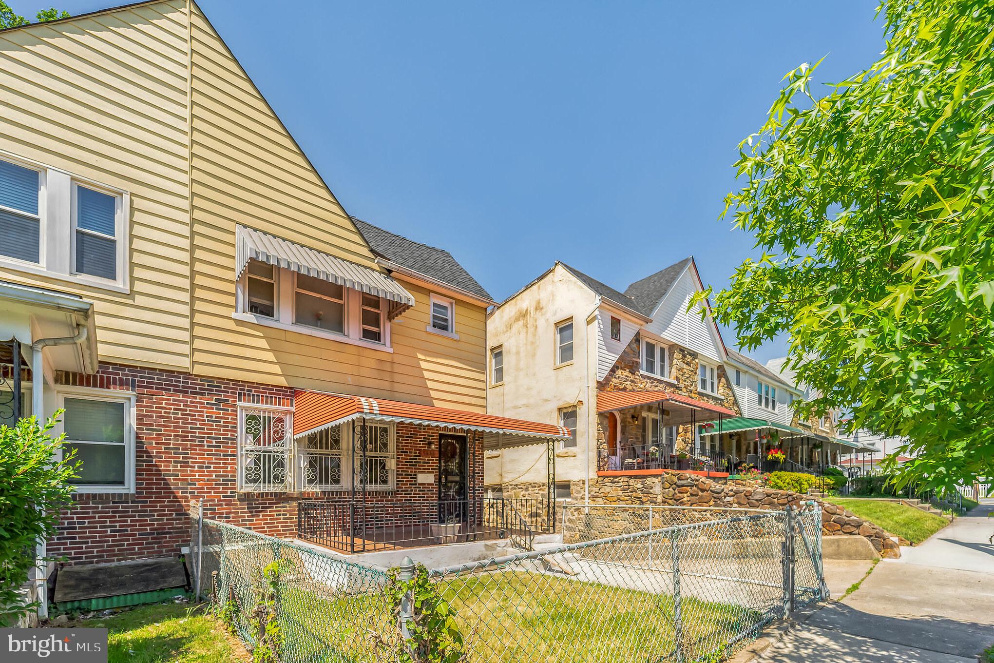 5446 Narcissus Avenue, Unit 1 Baltimore, MD 21215 - Photo 3 of 21 a view of a white house with swimming pool and a small yard