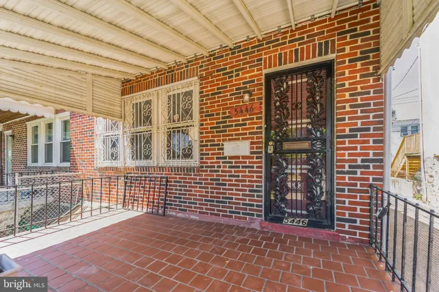 a view of a brick house with an outdoor space