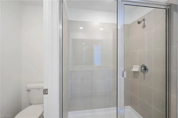 a bathroom with a double vanity sink mirror and double