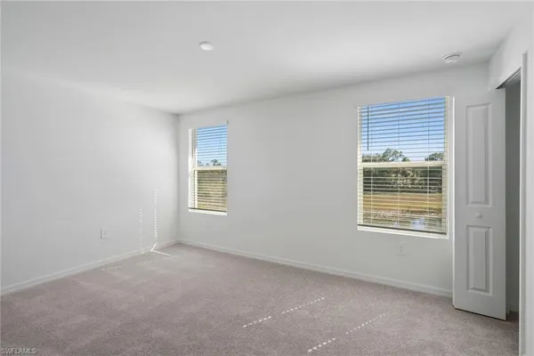 a view of kitchen with kitchen island and stainless steel appliances