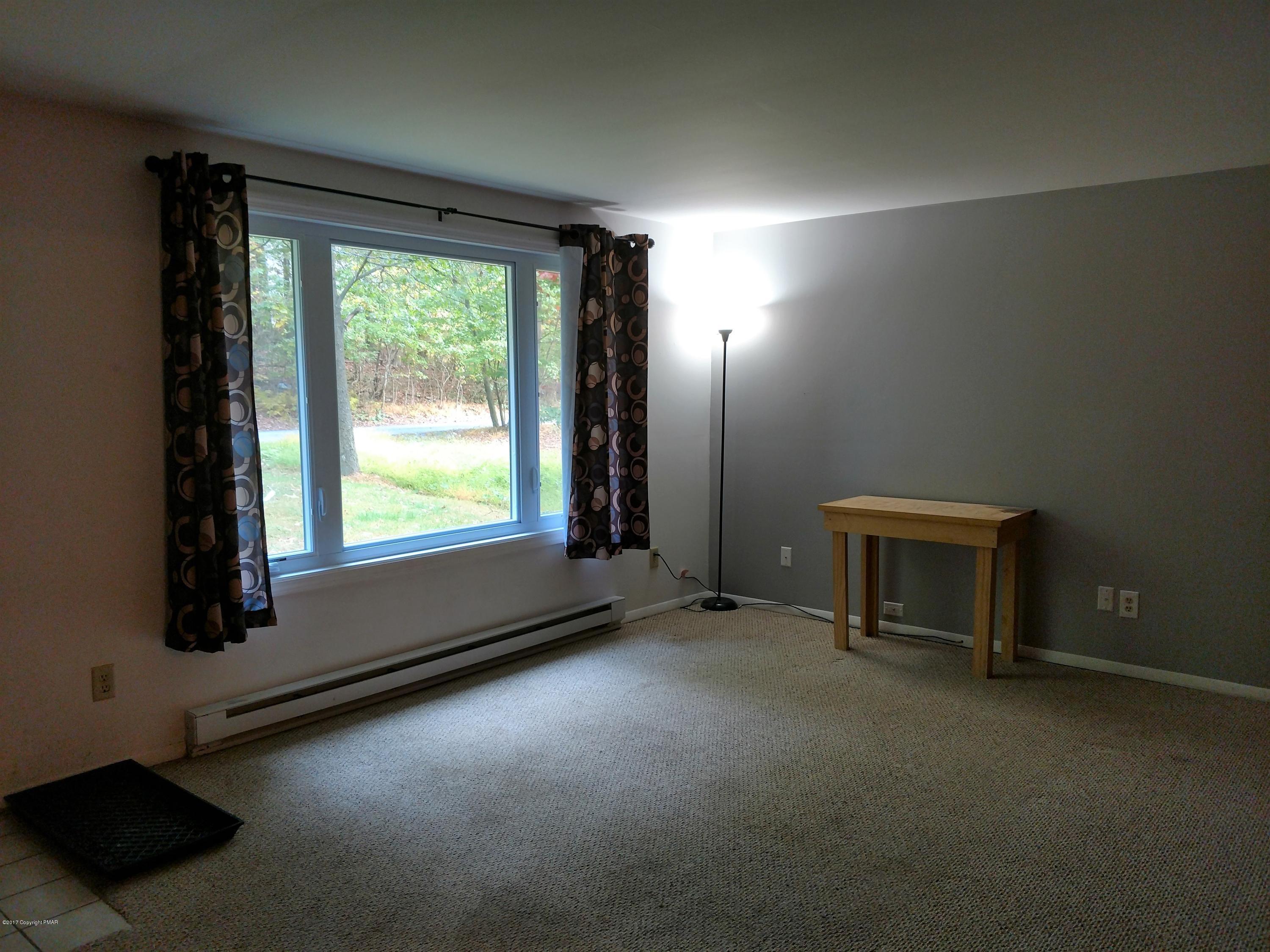 1416 Silver Maple Road Effort, PA 18330 - Photo 4 of 21 an empty room with windows