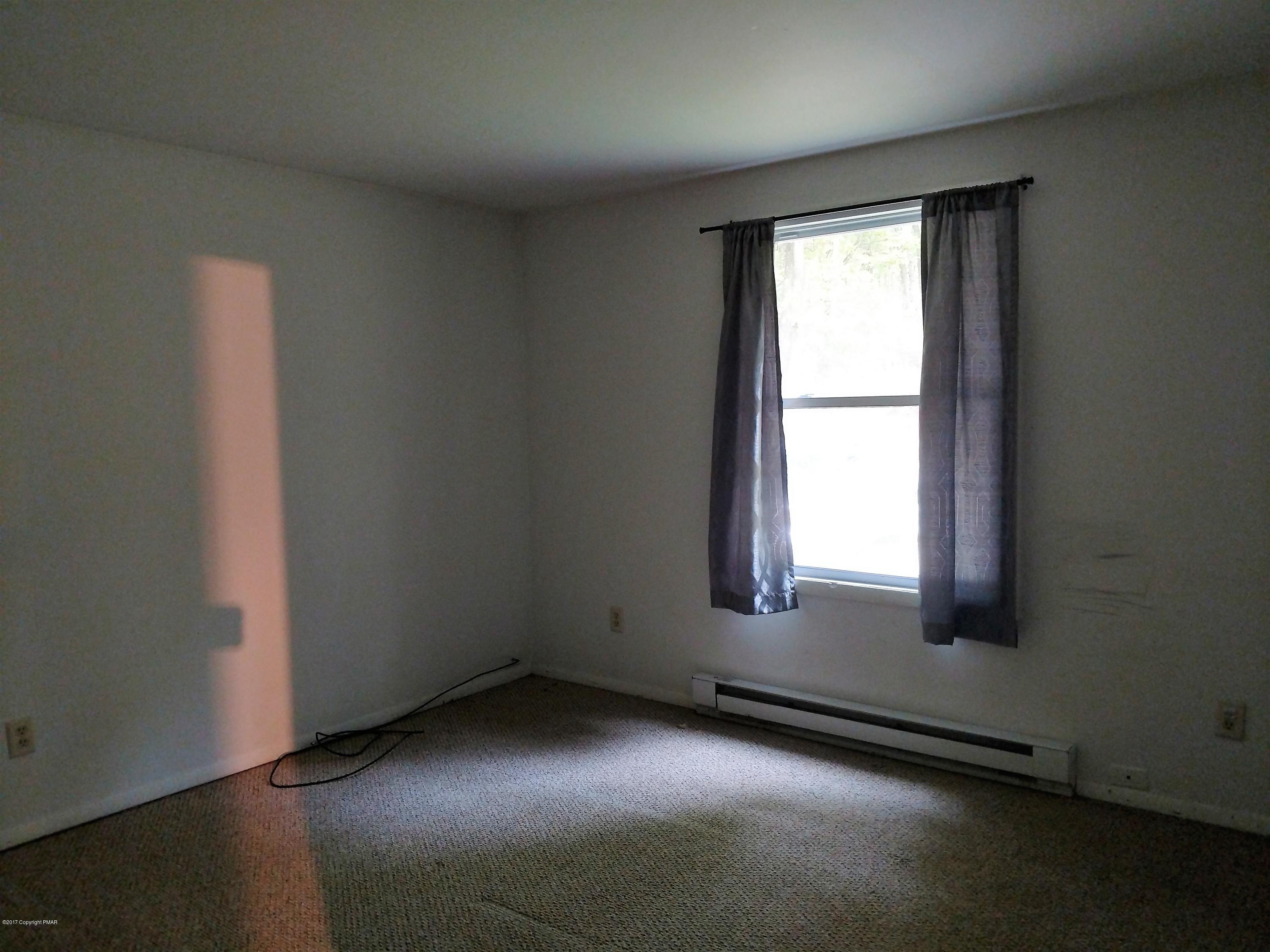 1416 Silver Maple Road Effort, PA 18330 - Photo 8 of 21 an empty room with a window