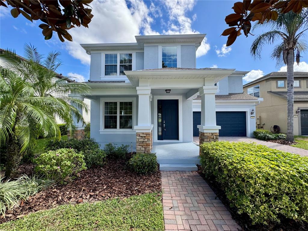 7343 Derexa Drive Windermere, FL 34786 - Photo 1 of 1 a front view of a house with garden