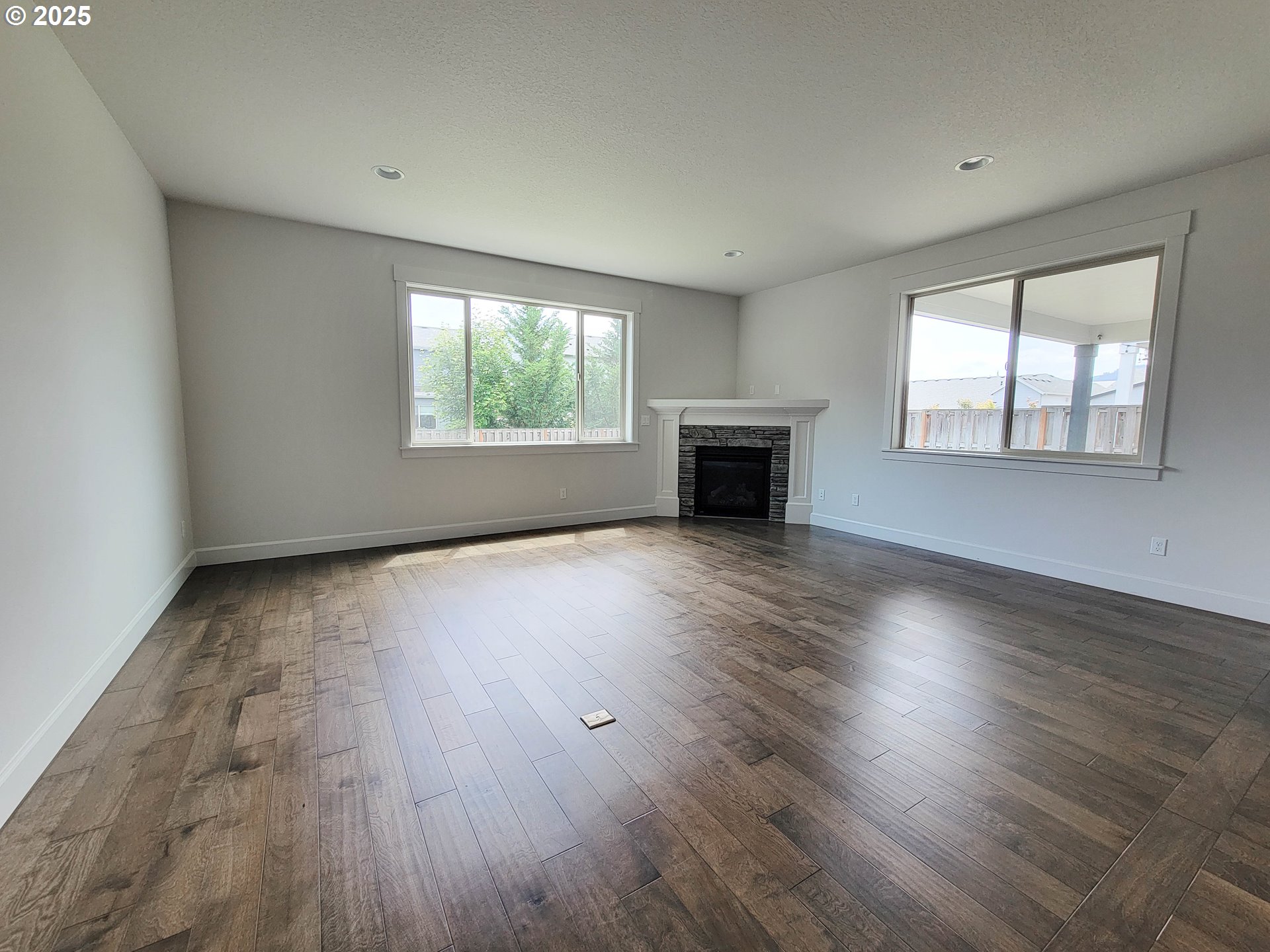 1222 Brookside Avenue Forest Grove, OR 97116 - Photo 12 of 30 an empty room with wooden floor and windows
