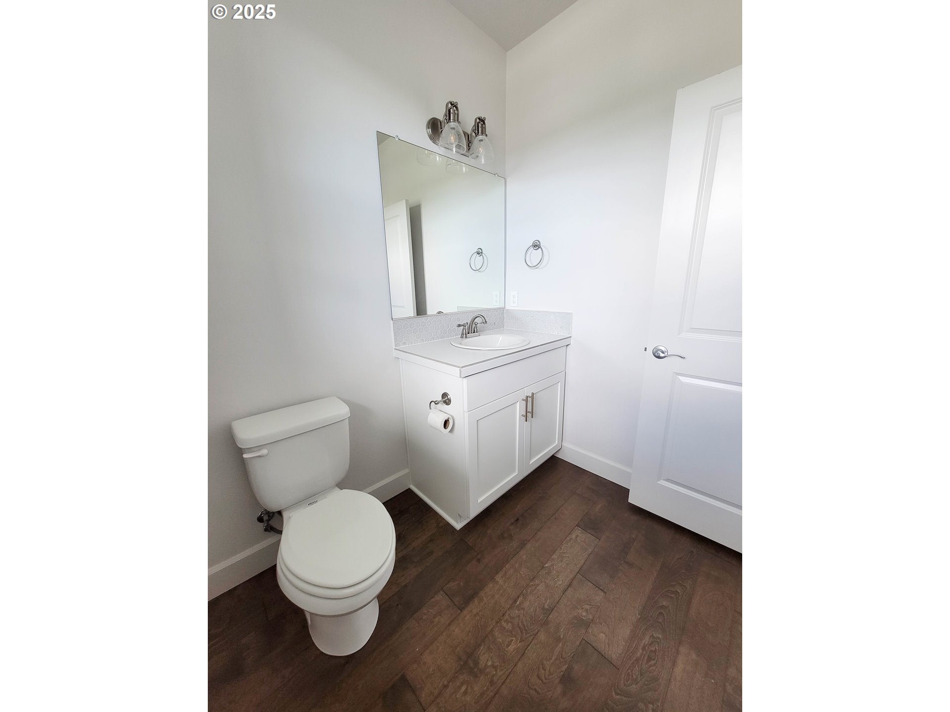 1222 Brookside Avenue Forest Grove, OR 97116 - Photo 4 of 30 a bathroom with a toilet a sink and mirror