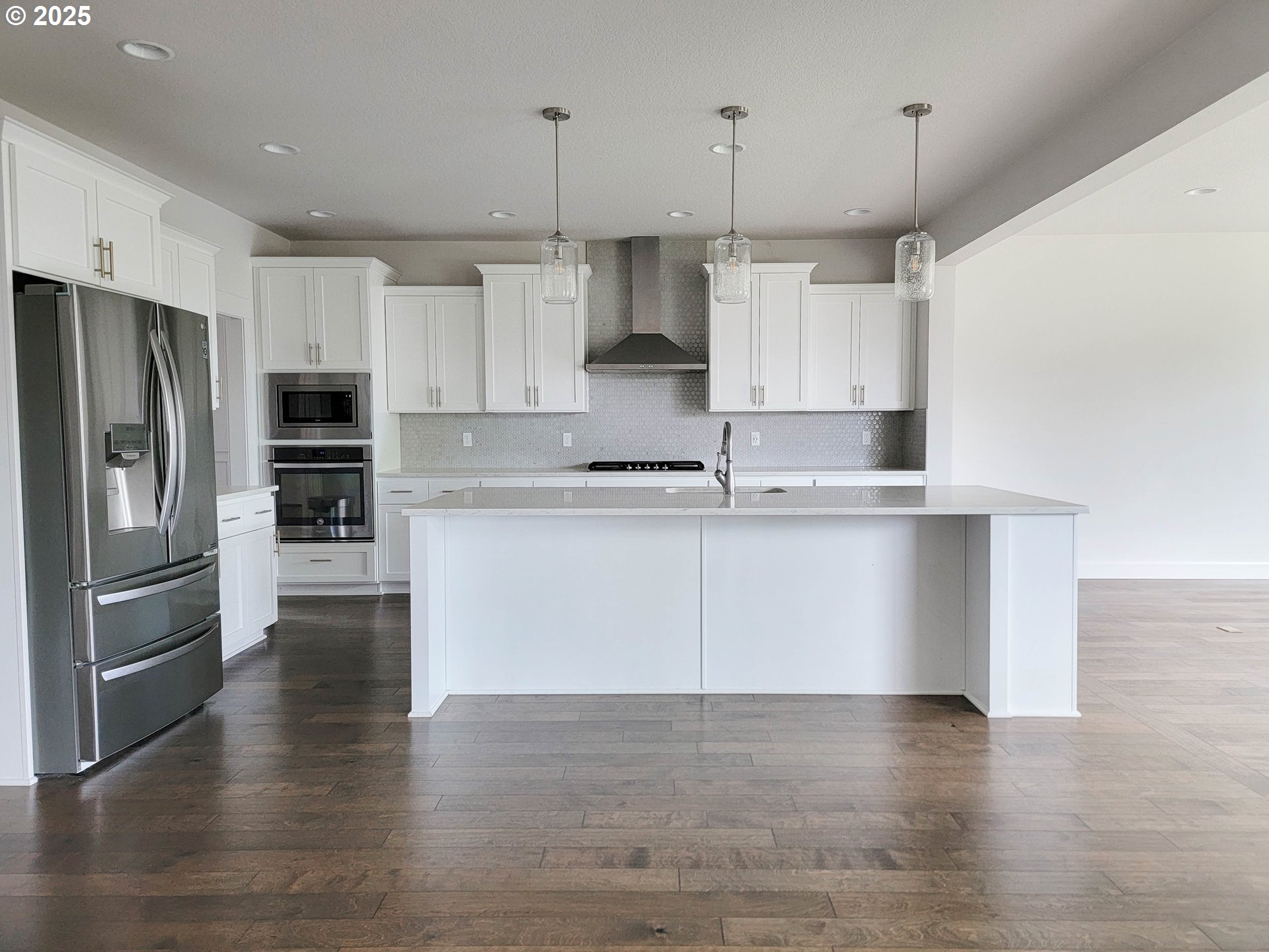 1222 Brookside Avenue Forest Grove, OR 97116 - Photo 7 of 30 a kitchen with stainless steel appliances granite countertop a refrigerator a oven a sink and white cabinets
