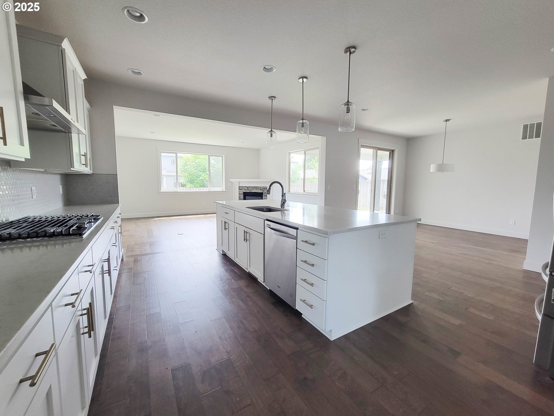 1222 Brookside Avenue Forest Grove, OR 97116 - Photo 9 of 30 a large kitchen with granite countertop a large counter top a sink stainless steel appliances and cabinets
