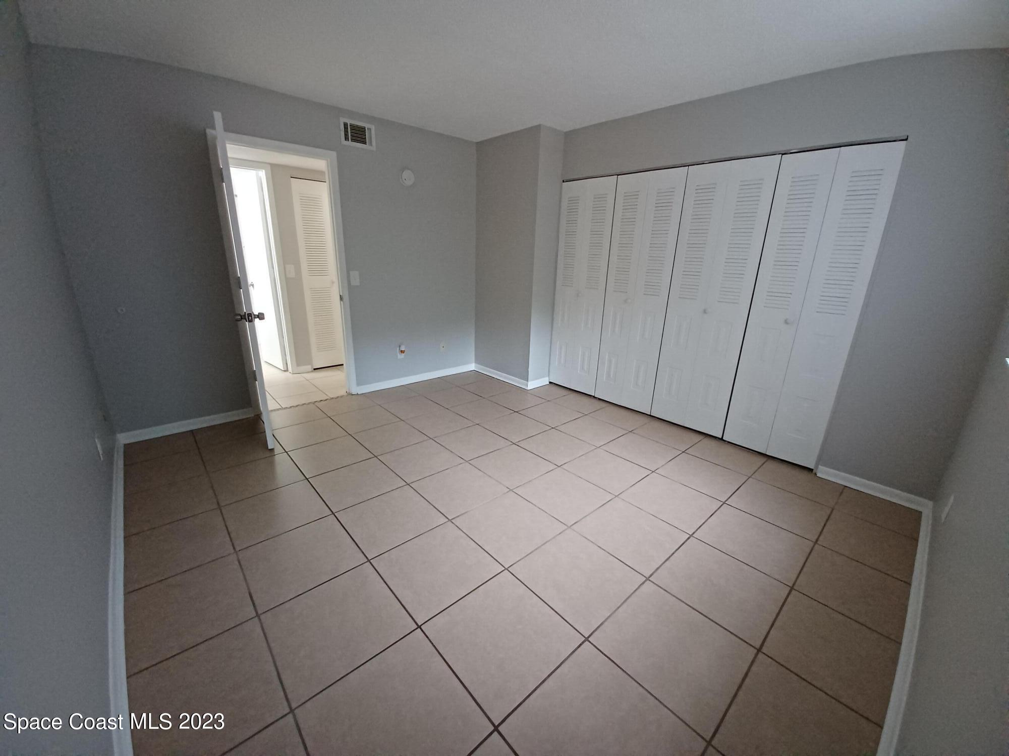 1698 Sunny Brook Lane, Unit G110 Palm Bay, FL 32905 - Photo 16 of 18 a view of a livingroom and closet