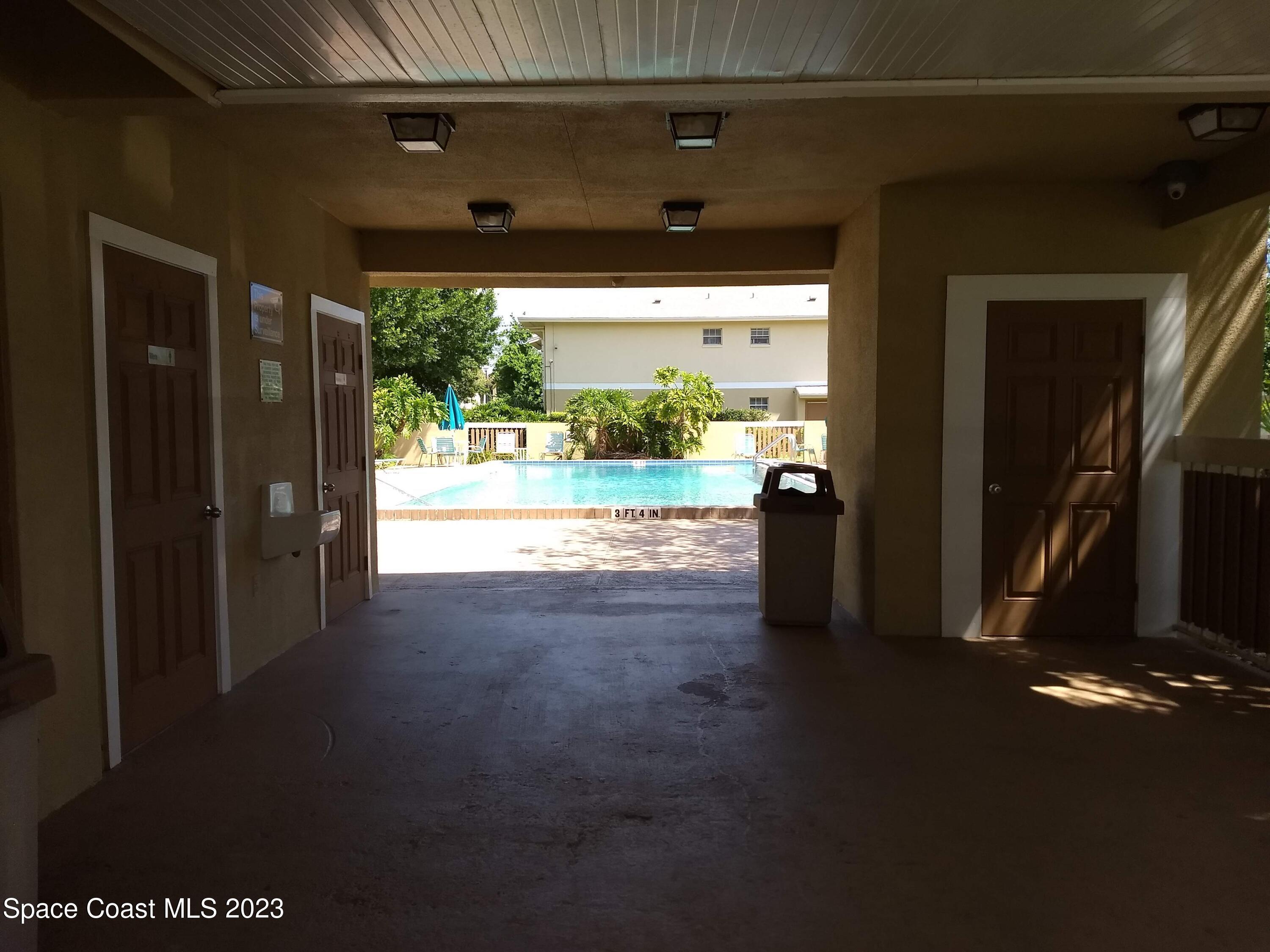 1698 Sunny Brook Lane, Unit G110 Palm Bay, FL 32905 - Photo 18 of 18 a view of a floor to ceiling window and a room