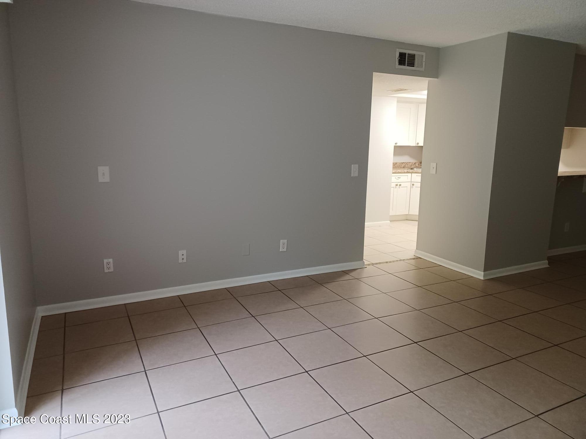 1698 Sunny Brook Lane, Unit G110 Palm Bay, FL 32905 - Photo 5 of 18 a view of an empty room and storage