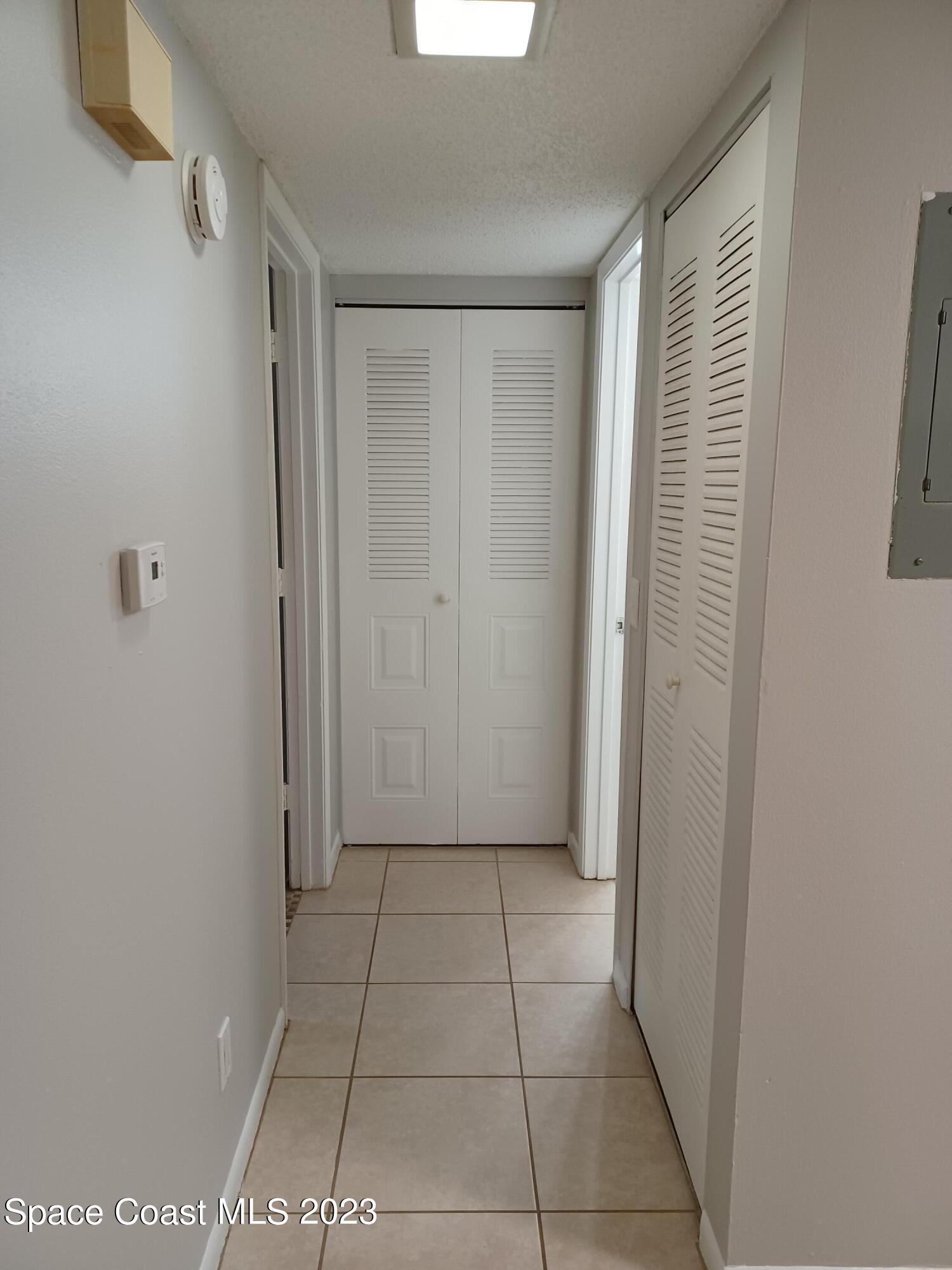 1698 Sunny Brook Lane, Unit G110 Palm Bay, FL 32905 - Photo 9 of 18 a view of an empty room with a window
