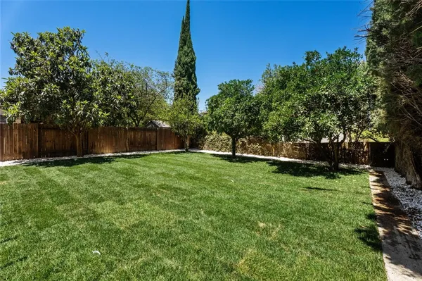 a view of a backyard with a garden