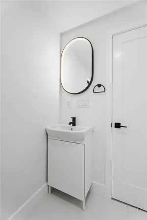 a bathroom with a sink a vanity and a mirror