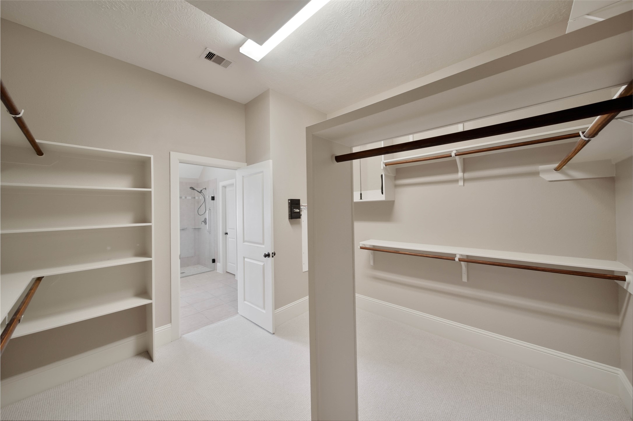 1215 Jake Springs Court Spring, TX 77386 - Photo 19 of 49 The walk-in closet offers plenty of room for your wardrobe. There's a linen closet in the bath for additional storage.
