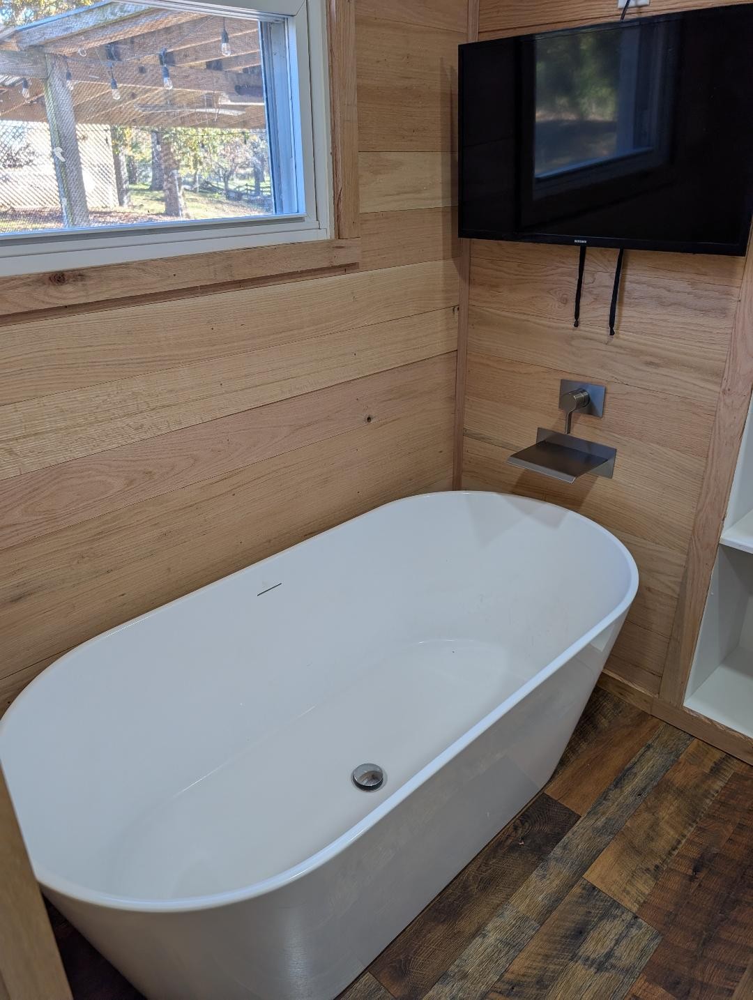 11774 Hopkinsville Road Princeton, KY 42445 - Photo 15 of 25 a bath tub sitting in a bathroom next to a sink