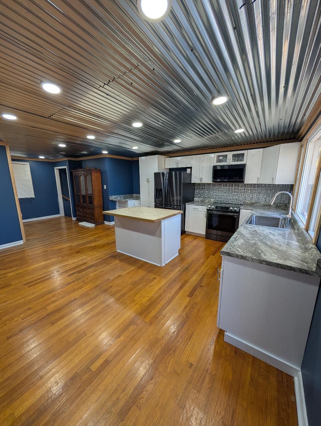 11774 Hopkinsville Road Princeton, KY 42445 - Photo 4 of 25 a large kitchen with stainless steel appliances granite countertop a large kitchen counter top a sink and a dishwasher