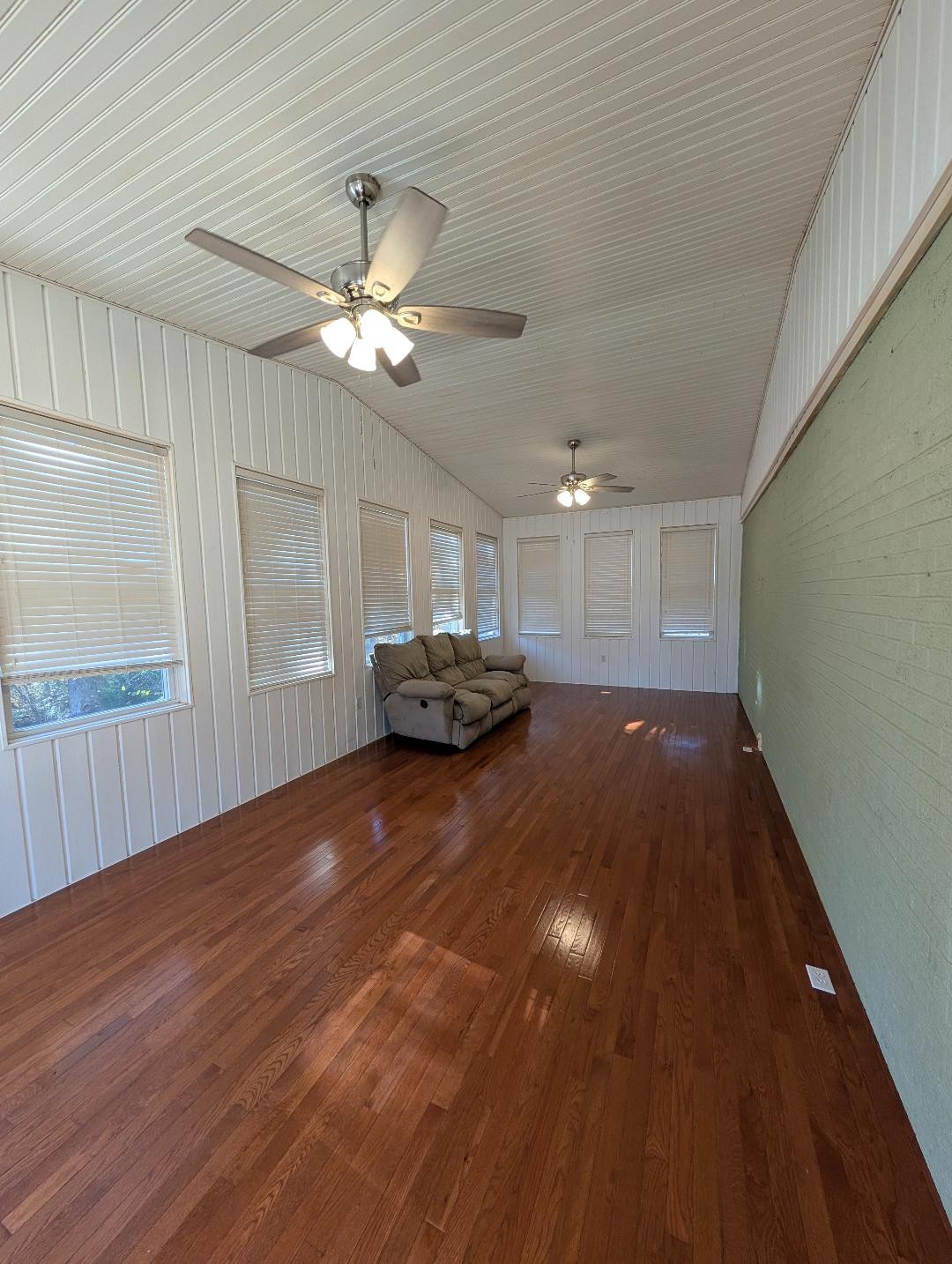11774 Hopkinsville Road Princeton, KY 42445 - Photo 8 of 25 a view of a livingroom with furniture wooden floor and a ceiling fan