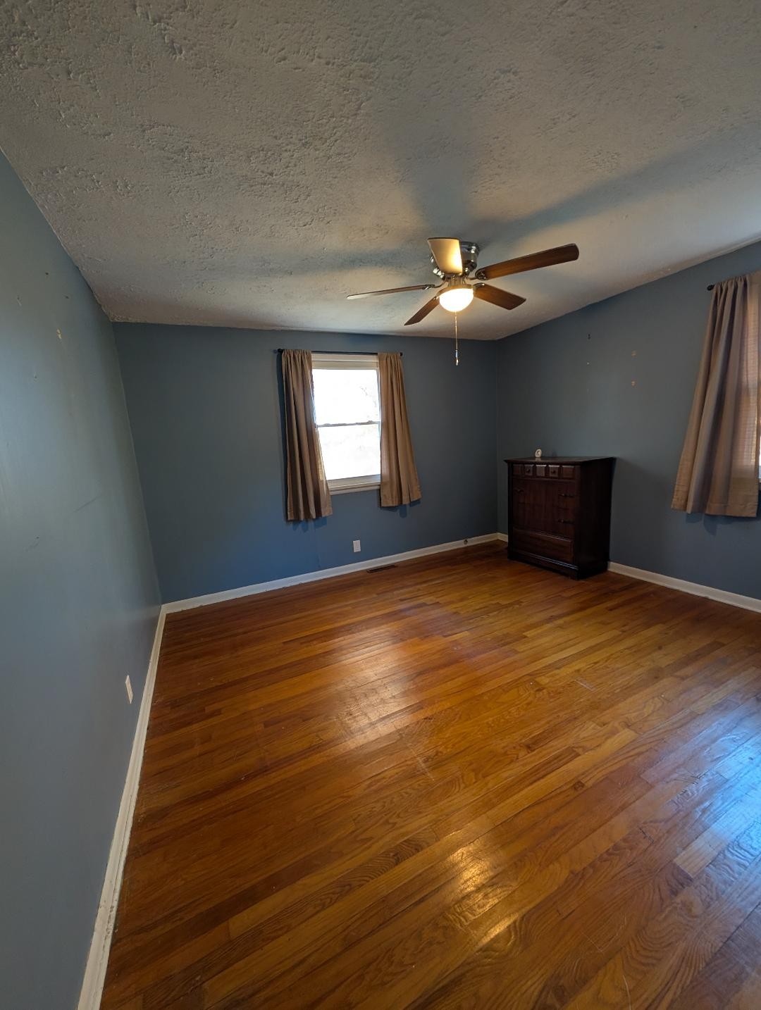 11774 Hopkinsville Road Princeton, KY 42445 - Photo 10 of 25 a view of an empty room with window and wooden floor