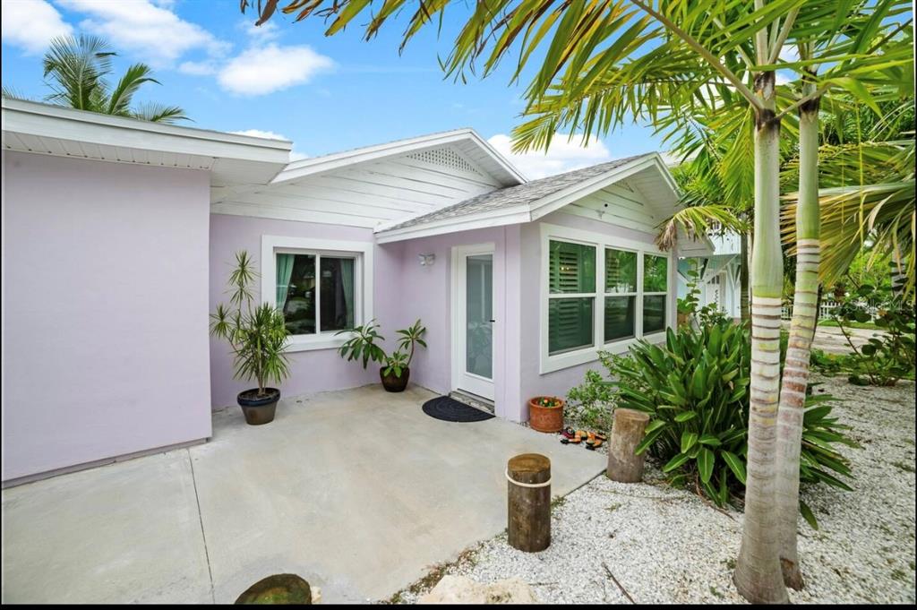 1210 Bay Palm Boulevard Indian Rocks Beach, FL 33785 - Photo 5 of 19 a view of a house with potted plants