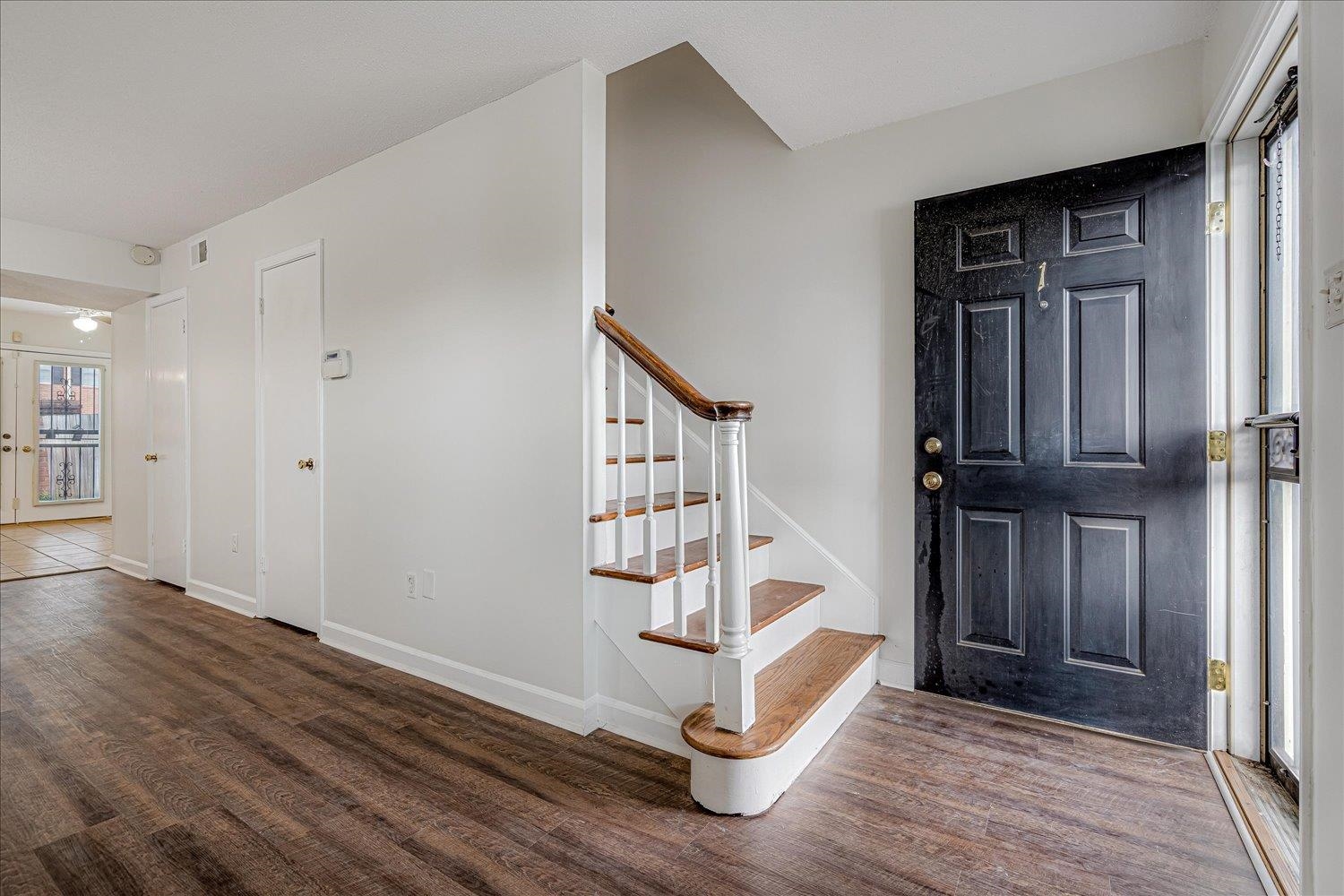 5696 Quince Road, Unit 1 Memphis, TN 38119 - Photo 12 of 26 Entryway with dark wood-type flooring and stairway